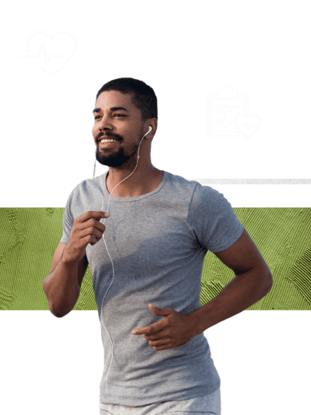 A man in a gray t-shirt jogs against a black and green background, wearing earbuds, symbolizing health and wellness.