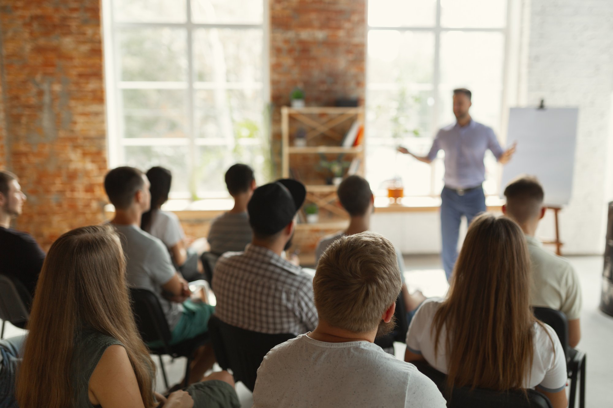 person talking to a group of people